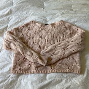 Pink sweater with paterns